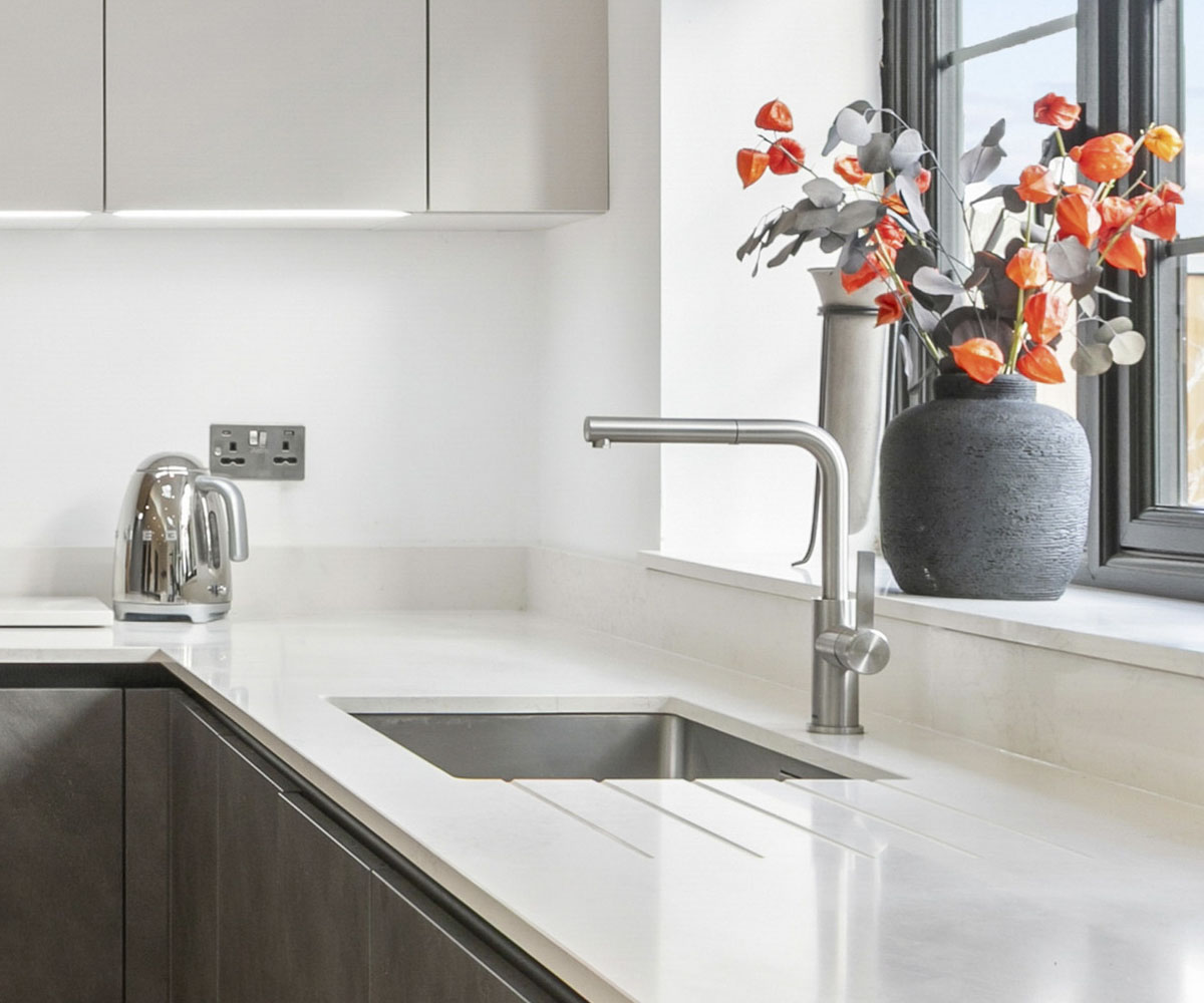 Premium boiling water tap installed beside a kitchen sink in a completed C and C Kitchens project