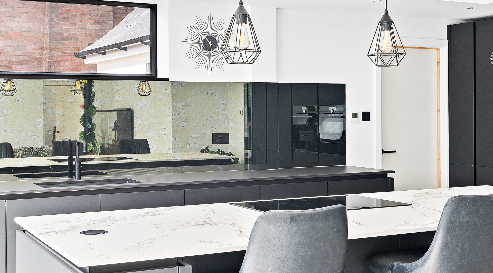 C&C kitchens Hertfordshire - Nolte Kitchens Matt Black Handleless Kitchen