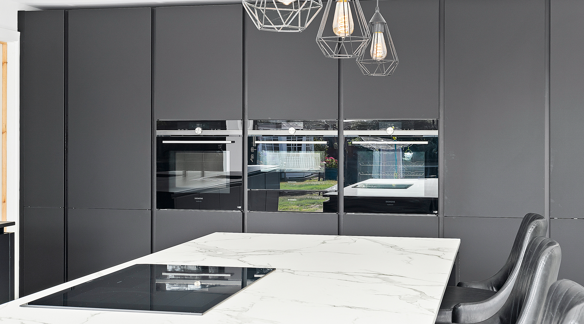 C&C kitchens Hertfordshire - Nolte Kitchens Matt Black Handleless Kitchen